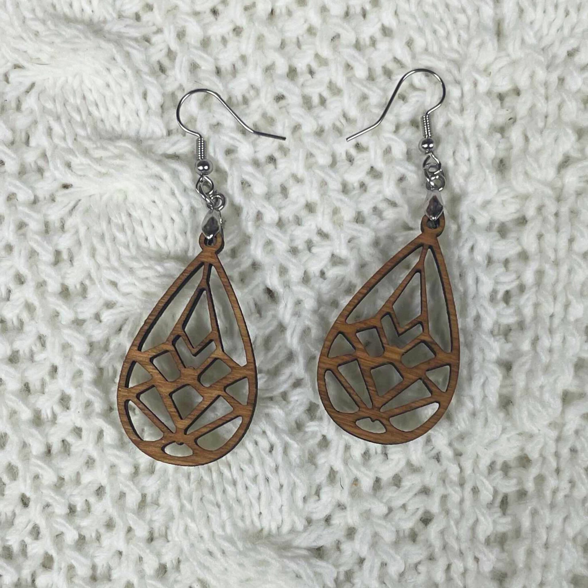 Boucle d'oreille en bois fabrication 
artisanal